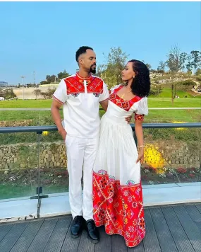 Passionate Red Bliss: Vibrant Habesha Couples Outfit in Menen Fabric