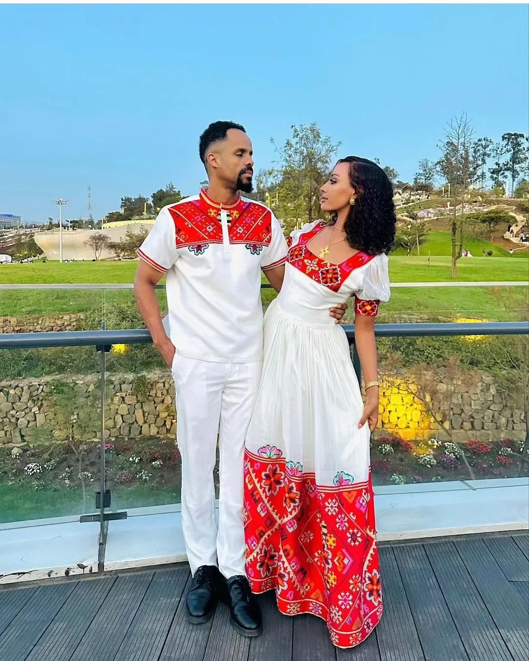 Passionate Red Bliss: Vibrant Habesha Couples Outfit in Menen Fabric